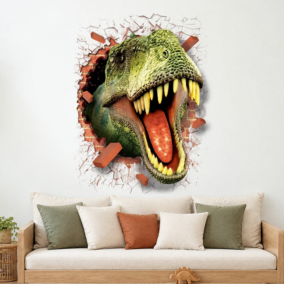 Sticker mural dinosaure 3D traversant un mur de briques au-dessus d'un lit de repos en chêne clair à coussins sauge, crème et rouille