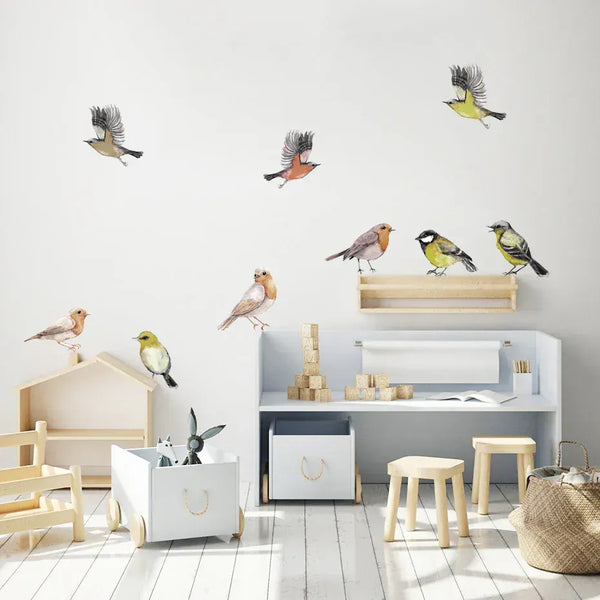 Little watercolour birds wall stickers perched and flying in a kids' playroom