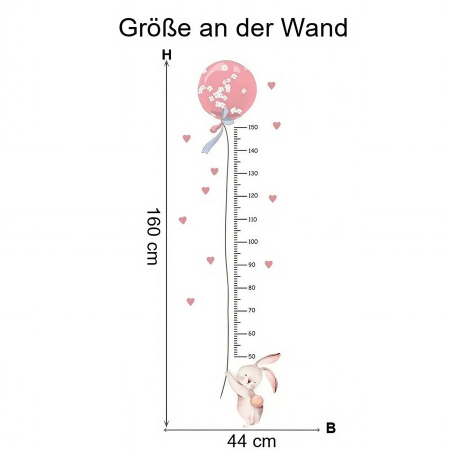 Der gelieferte Bogen im Vergleich zum Motiv an der Wand: Wandtattoo Messlatte Hase mit rosa Ballon fürs Mädchenzimmer